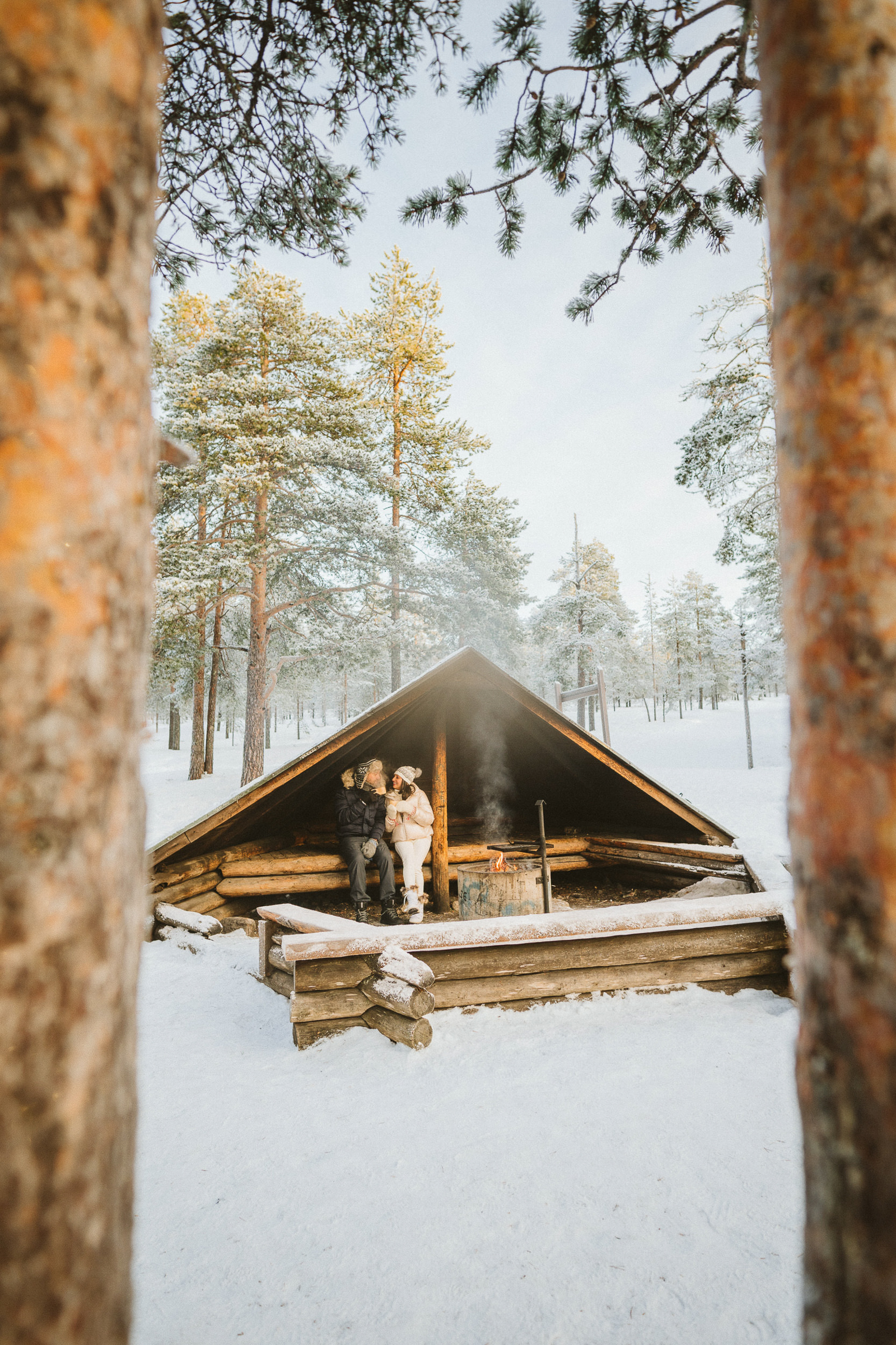 couple portrait in winter in Kuninkaanlaavu Rovaniemi Lapland Finland