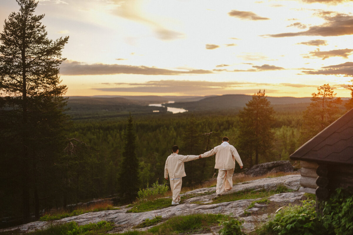 same sex couple under the midnight sun in Rovaniemi Finland