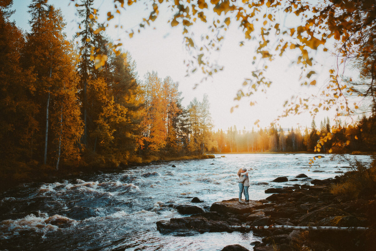 young couple at a river bank near Rovaniemi in Finnish Lapland