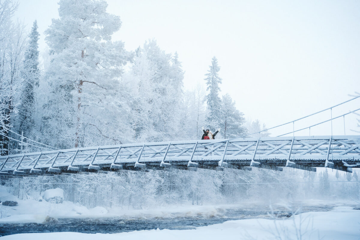 couple on a bridge in winter Rovaniemi